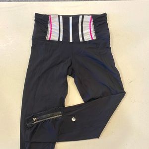 Lululemon leggings Size 4, Black with pink/white paneling, zippers at ankle, 23”